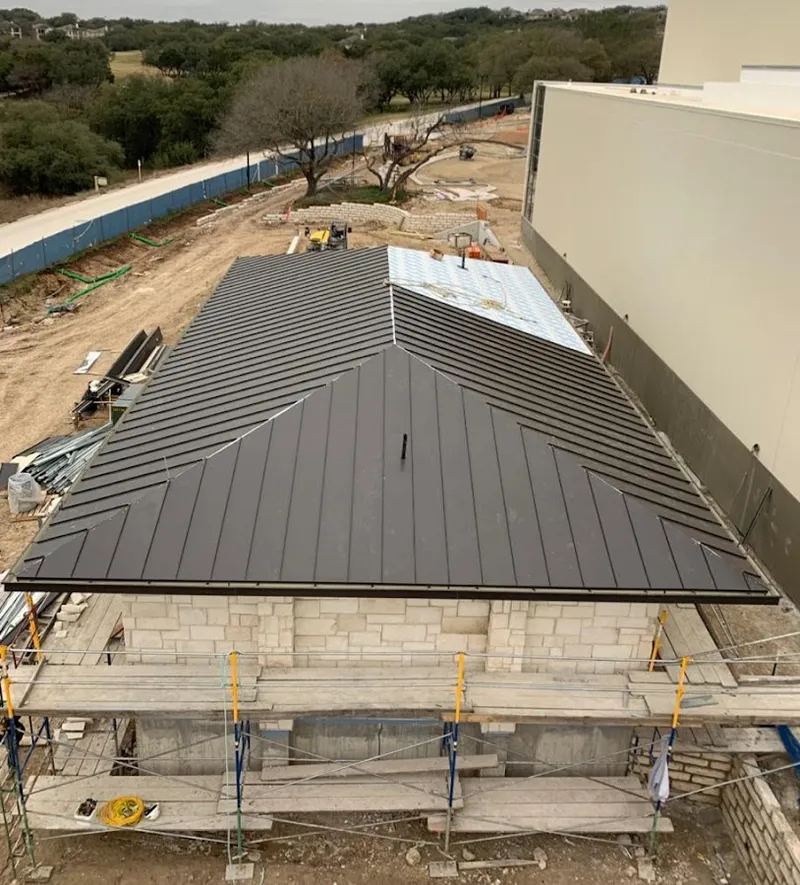 Metal roof new construction with scaffolding in Lufkin